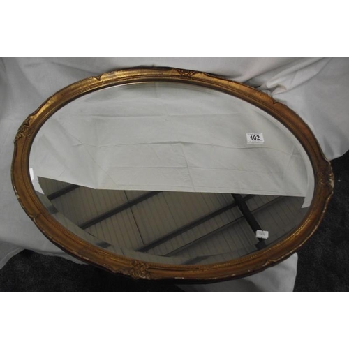 102 - A vintage ormalu gilt framed oval bevel edged mirror COLLECT ONLY