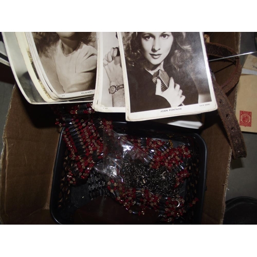 144 - A box of beads, badges, brooches, chains etc plus photographs and ephemera