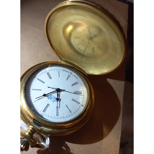 1023 - An ornate enamelled full hunter pocket watch in working order.