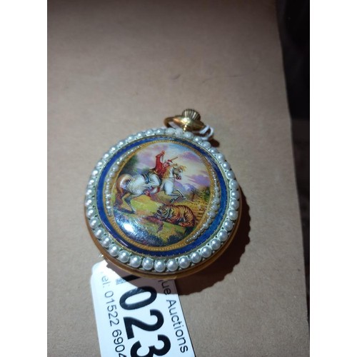 1023 - An ornate enamelled full hunter pocket watch in working order.