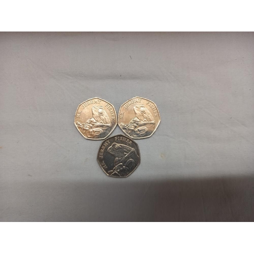 190 - A quantity of Beatrix Potter 50p coins (approximately £11.50) 2 money boxes and magnets