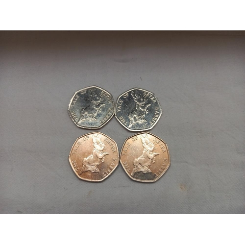 190 - A quantity of Beatrix Potter 50p coins (approximately £11.50) 2 money boxes and magnets