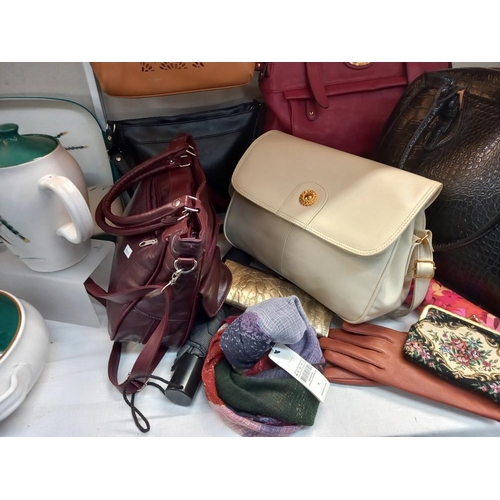 259 - A quantity of ladies handbags, gloves & umbrellas etc. COLLECT ONLY