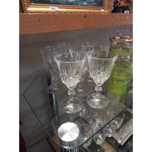 260 - A quantity of drinking glasses & a partial summer drinks set (2 shelves) COLLECT ONLY