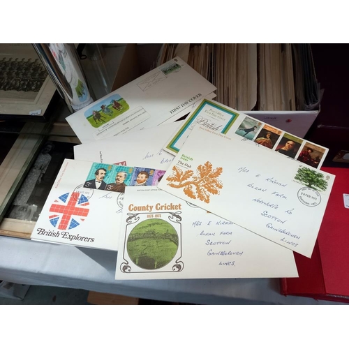 263 - A large quantity of first day covers in boxes & an album COLLECT ONLY