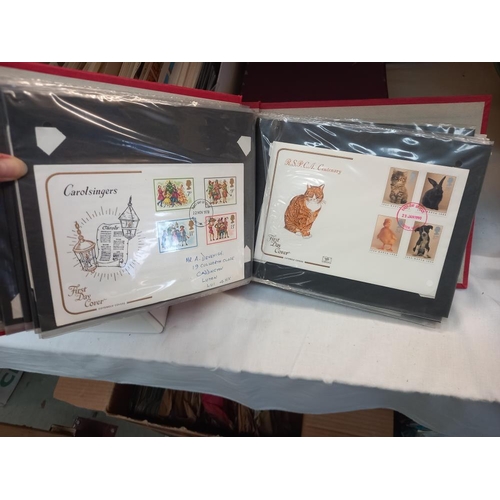 263 - A large quantity of first day covers in boxes & an album COLLECT ONLY