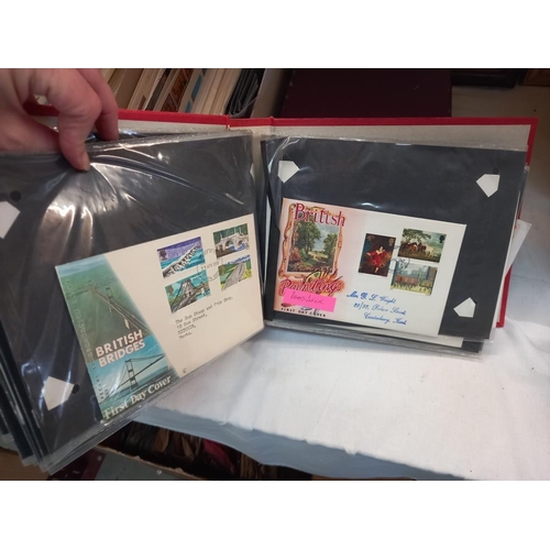 263 - A large quantity of first day covers in boxes & an album COLLECT ONLY