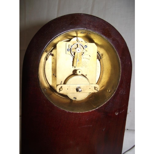 172 - A small French enamel faced clock with key (enamel slightly a/f)