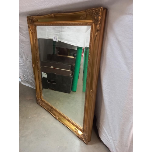 318 - A guilt framed bevel edge mirror