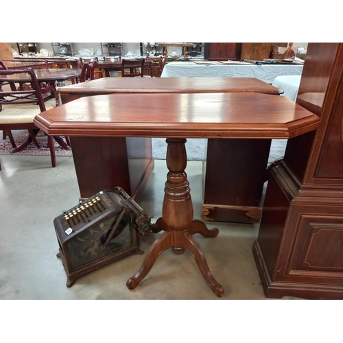 324 - An octagonal mahogany tea table on turned centre column, COLLECT ONLY.