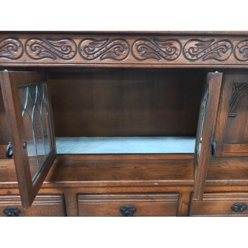 327 - A 1930's oak buffet with lead glazed doors, COLLECT ONLY.