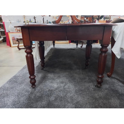 331 - A Victorian oval mahogany dining table. COLLECT ONLY.