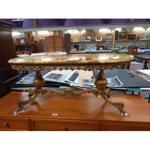 340 - A Vintage oval coffee table on brass base and with onyx top. COLLECT ONLY.