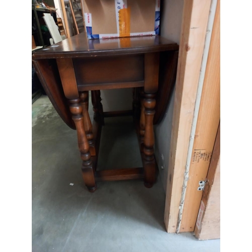 356 - A 1950's oak gateleg table. COLLECT ONLY.