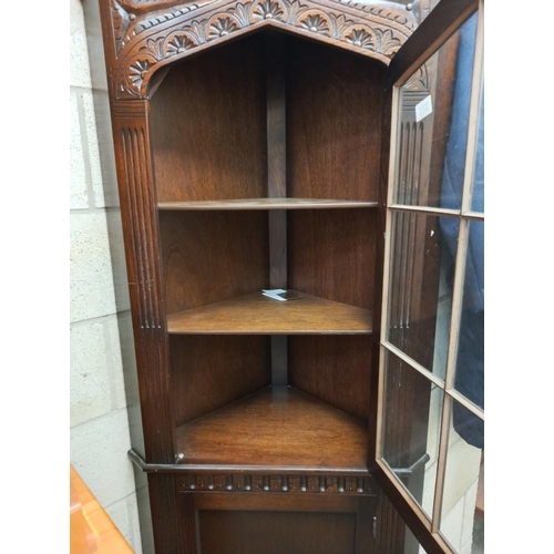 371 - An oak corner cupboard. COLLECT ONLY.