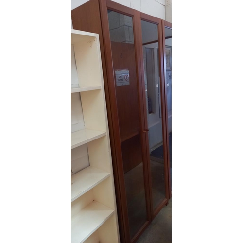 384 - A tall glazed two door display cabinet/bookcase, COLLECT ONLY