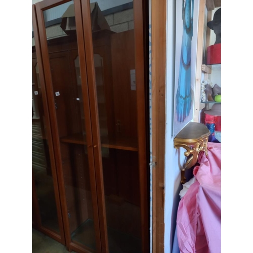 385 - A tall glazed two door display cabinet/bookcase, COLLECT ONLY