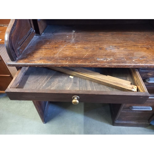 389 - A Victorian oak single pedestal roll top desk. COLLECT ONLY.