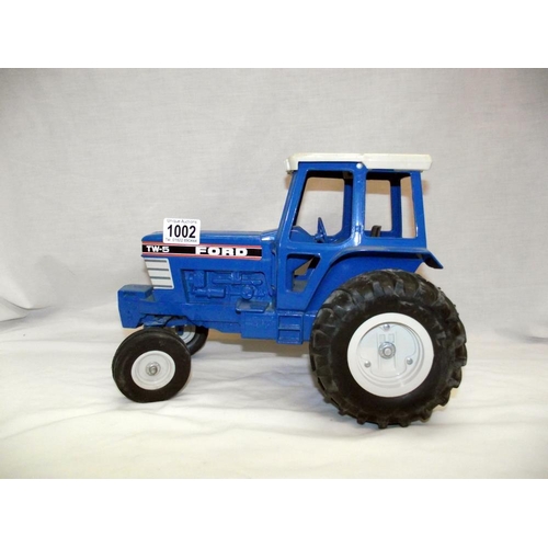 1002 - A large scale ERTL diecast Ford TW-5 tractor