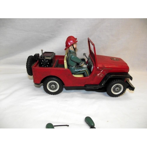 1005 - A vintage Nomura battery operated fire department Jeep, untested, base is loose