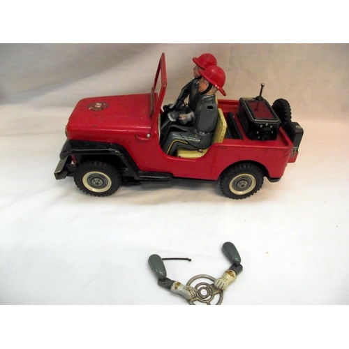 1005 - A vintage Nomura battery operated fire department Jeep, untested, base is loose