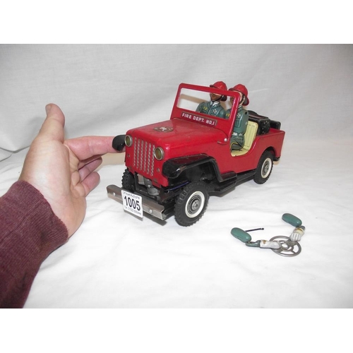 1005 - A vintage Nomura battery operated fire department Jeep, untested, base is loose