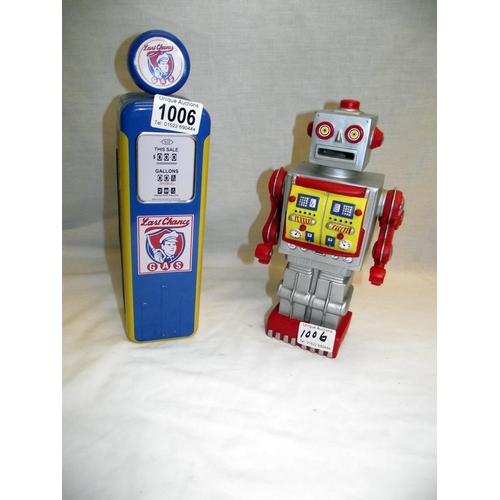 1006 - A Plastoy plastic robot money box and a Churchills petrol pump biscuit tin