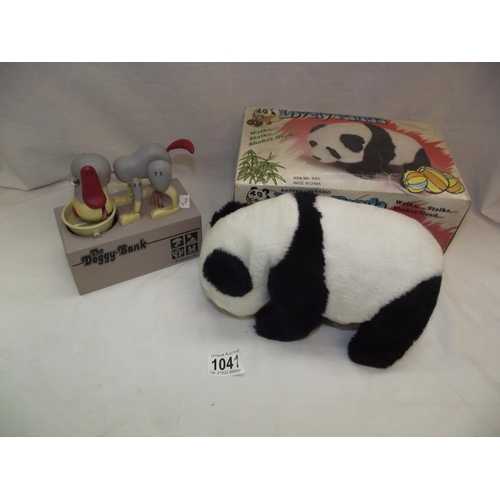 1041 - A boxed battery operated lovely Panda and a novelty dog money box