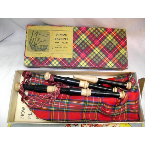 1065 - Junior bagpipes in original box and a vintage wooden drum