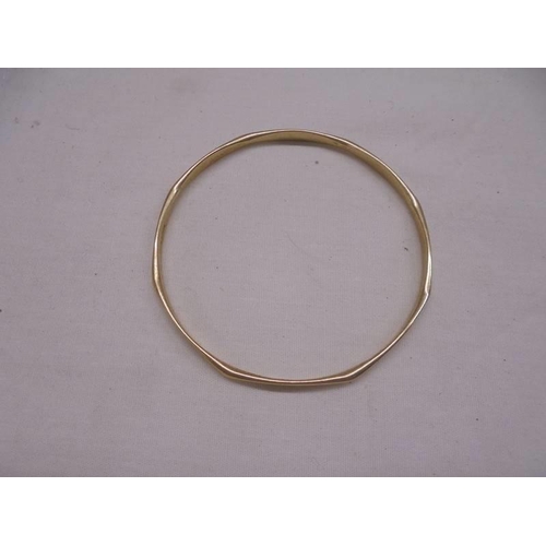 1003 - A 9ct gold bangle and a 9ct gold neck chain, 16.69 grams.