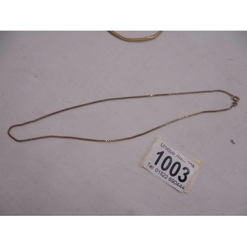 1003 - A 9ct gold bangle and a 9ct gold neck chain, 16.69 grams.