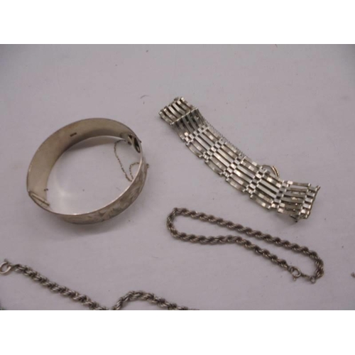 1004 - A silver bangle, silver neck chain, silver bracelet, silver locket and silver cross etc., 99 grams (... 