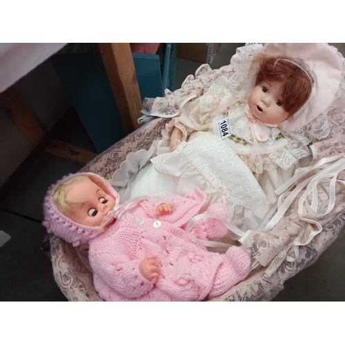 1084 - An antique style dolls pram and contents COLLECT ONLY