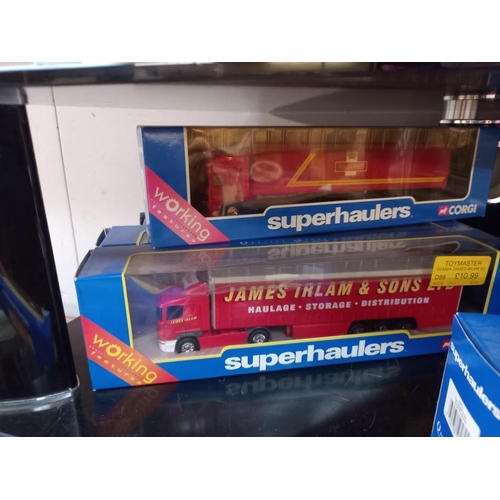 1115 - 11 boxed Corgi Superhaulers trucks