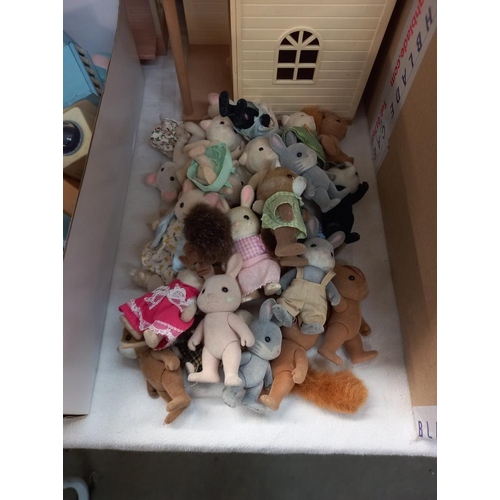 1123 - A quantity of Sylvanian figures, house and contents etc