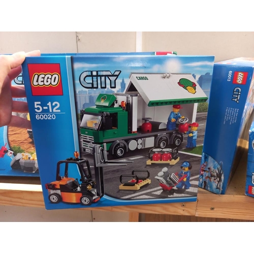 1128 - 5 boxed and unopened Lego city sets