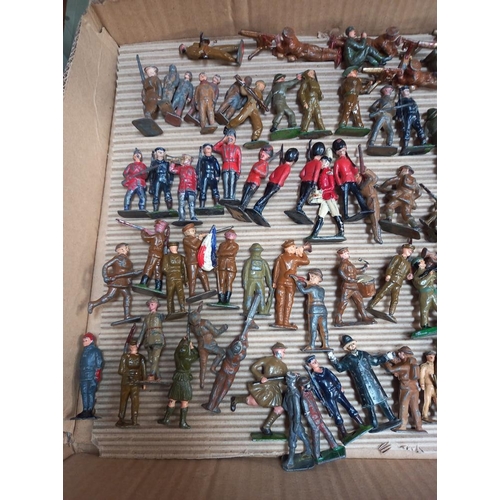 1226 - A large tray of early mainly Britain's soldiers including some with articulated arms