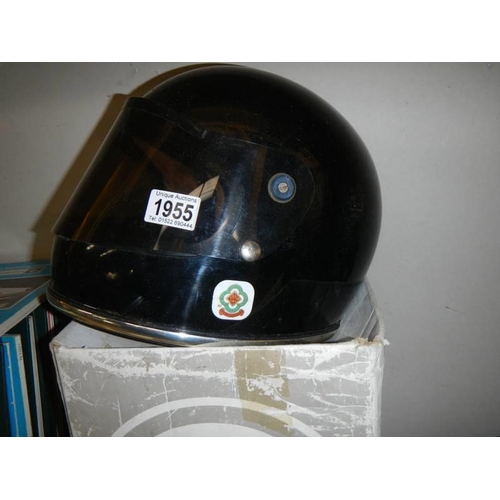 1955 - A boxed vintage Griffin black motorcycle helmet with tinted visor.