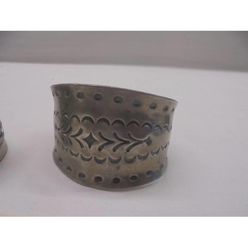 1012 - A Jorgen Jensen pewter cuff and one other.