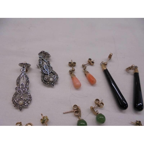 1014 - Six pair of 9ct gold earrings (coral/pearl etc.,) and a pair of marcasite earrings.