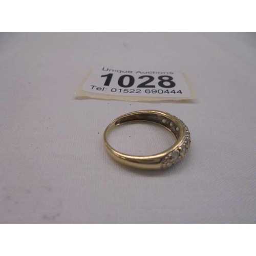 1028 - A yellow gold multi-stone cushioned ring, size L, 2.1 grams.