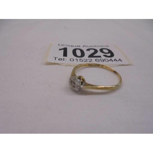 1029 - An 18ct gold floral design ring, size L, 1.3 grams.