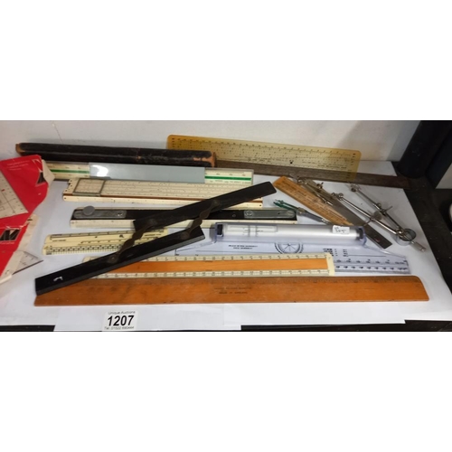 1207 - A quantity of measuring devices, rulers, compasses etc