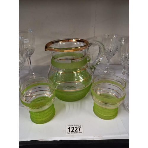 1227 - A quantity of drinking glasses & a lovely vintage water/juice jug with green stripes COLLECT ONLY