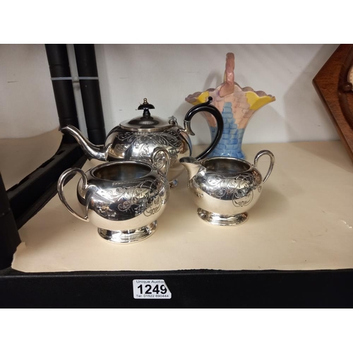 1249 - A 3 piece silver plate tea set (teapot, milk jug and sugar bowl) plus an Arthur Wood ceramic basket