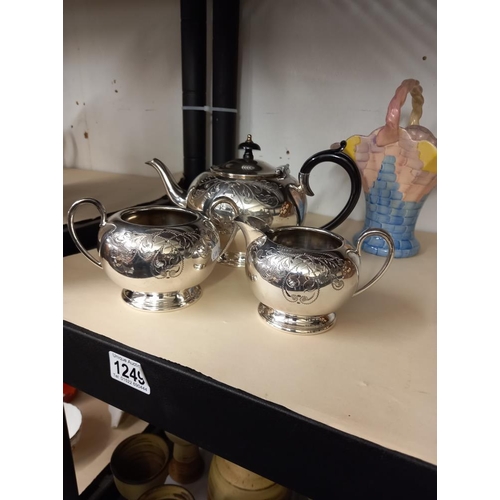 1249 - A 3 piece silver plate tea set (teapot, milk jug and sugar bowl) plus an Arthur Wood ceramic basket