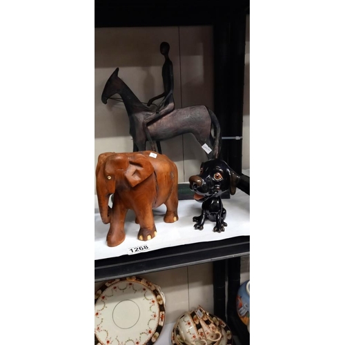 1268 - A quantity of elephants, china dog and an unusual horse and rider figure COLLECT ONLY