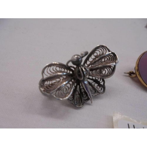 1047 - A filigree silver bug brooch, a 19thC brooch set with pearl in a hard mount (gold tested) and a natu... 