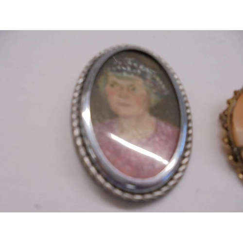 1052 - A silver fob watch, mid century portrait miniature in oils in silver frame, a brooch/pendant cameo a... 