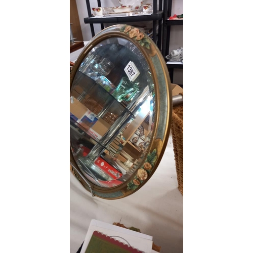 1387 - A decorative round mirror with floral surround COLLECT ONLY